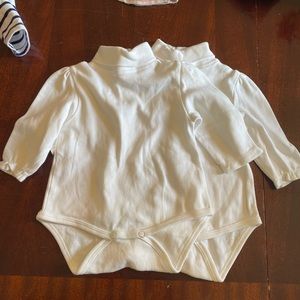 Two turtleneck onesies
